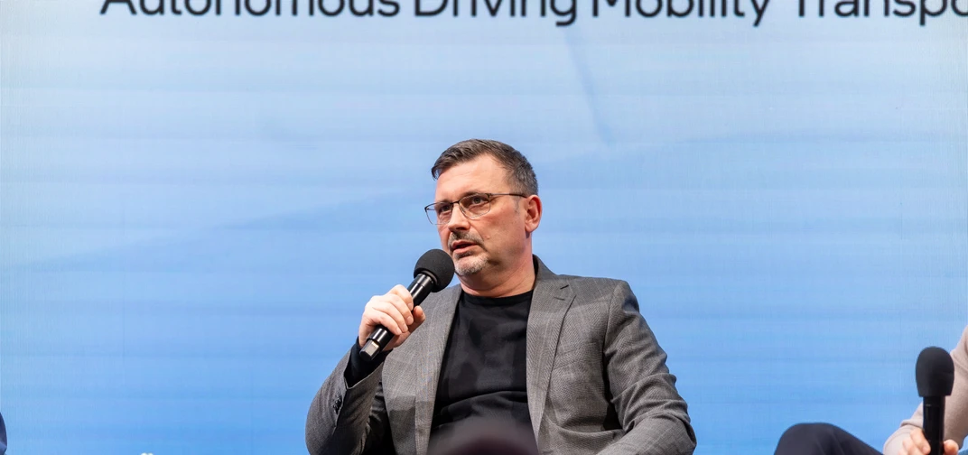 Volkswagen SVP Sebastian Lasek speaking at the Mobileye booth