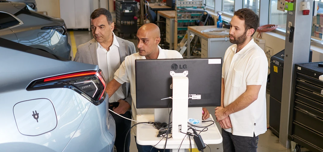 Professor Amnon Shashua, President and CEO of Mobileye, with employees in the Company's vehicle workshop.