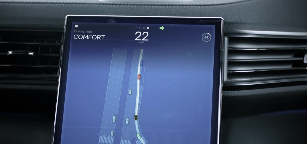 An interior screen of a Mobileye development AV operating in Comfort Mode visualizes the path forward based on Mobileye sensing.