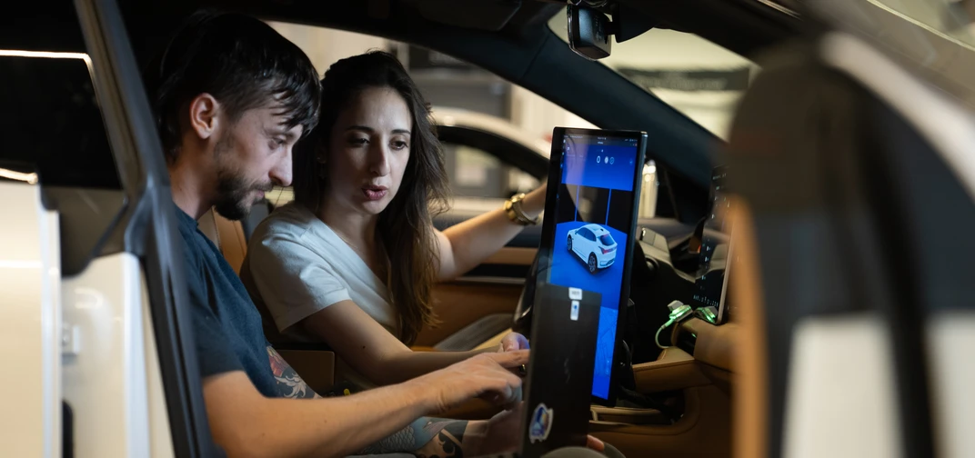 Mobileye employees are shown working from the custom-built vehicle workshop located in Mobileye's global headquarters.